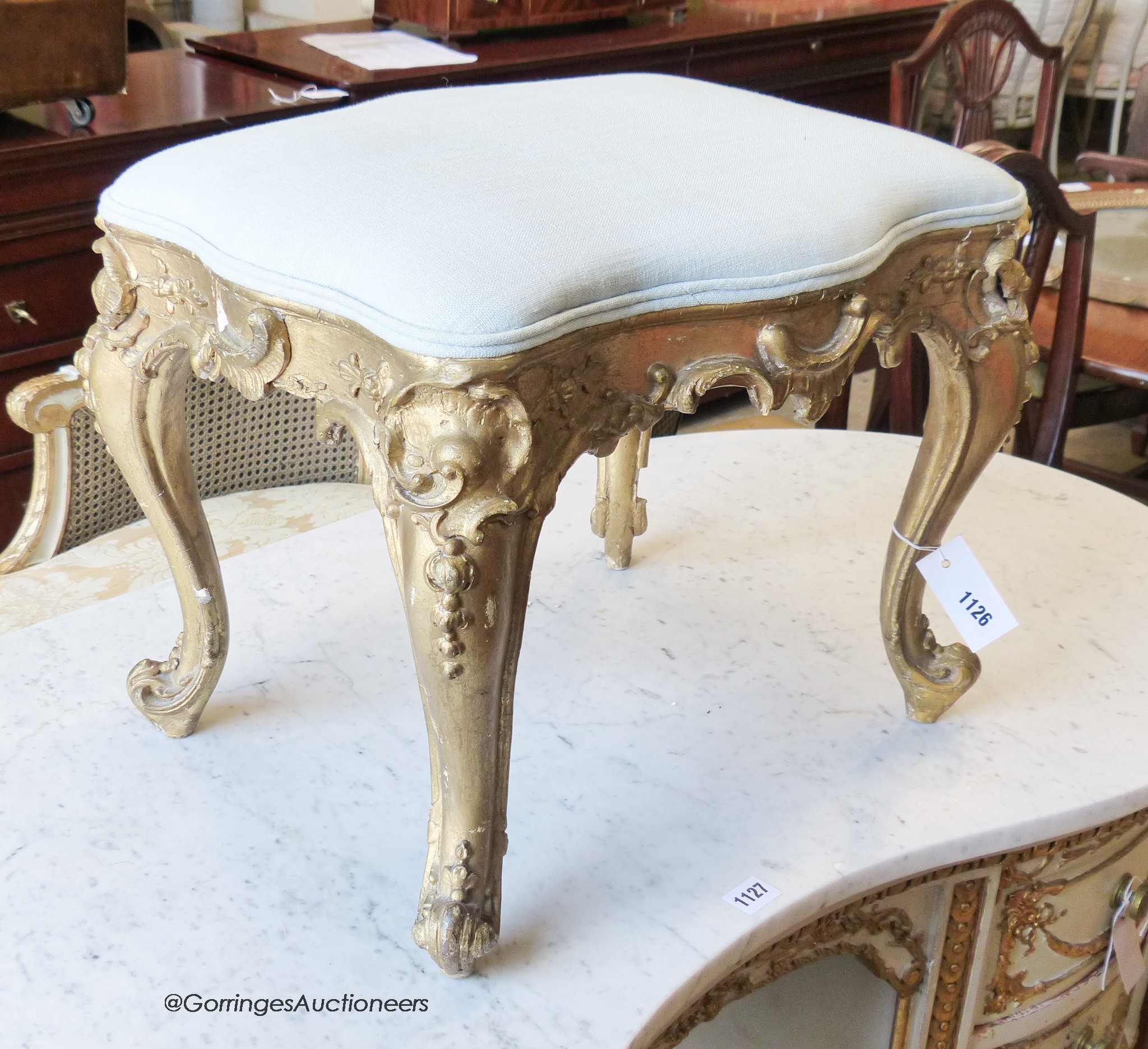 A Louis XV style carved giltwood and gesso dressing stool, width 49cm, depth 37cm, height 39cm